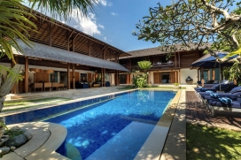 This luxury holiday villa is a peaceful oasis in the heart of fashionable Petitenget. A short stroll from the sweeping Petitenget beach, which is well-known for its surfbreaks, panoramic coastline views and picture-perfect sunsets. A wide choice of world-renowned, fine dining restaurants, including the famous Ku De Ta, Hu'u bar, Livingroom, La Lucciola, and Blossom at Sentosa, are all less than a kilometer away, and the area also boasts a growing number of designer boutiques. Nearby places of interest include one of Bali's most sacred Hindu temples, Pura Petitenget, the fourth largest temple in Bali, where some of the most spectacular Balinese ceremonies may often be witnessed. The four-bedroom villa is characterized by an abundance of teakwood and marble and is comprised of two shingle-roof pavilions housing a magnificent open-sided living and dining area, a cozy media room, an entertainment terrace, a gym, four bedrooms on two levels, a kitchen and a service area. The property is set within a delightful walled garden complete with a feature swimming pool, and nestled within a safe and secure private estate, just a few minutes' walk from the beach, a whole host of world-class restaurants and nightclubs. It is ideal for families with older children.Service and Facilities, Seminyak