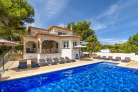 Luxury holiday villa in Javea - Costa Blanca, with private swimming pool for 10-12 people.Magnificent 3 storey villa located on a hillside and offering views across the wooded surroundings. The villa is close to the idyllic bay La Granadella. With the serenity and peacefulness of the area and still within short distance of all amenities, this villa combines privacy and comfort. Tastefully decorated interior and a spacious covered terrace with outdoor furniture, ideal for relaxing and outdoor dining, while overlooking the pool area. The spacious sun terrace with barbecue, surrounding the large infinity pool is the place for spending endless lazy hours, reading, sunbathing and swimming.Enjoy a relaxing stay in this wonderful villa with your family or friends!Main Level, Javea