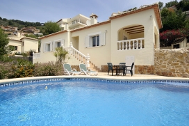 Holiday rental villa on the Costa Blanca, Spain, with private swimming pool for up to 6 people . Luxury villa, situated in the foothills of the Montgo above the old port of Javea, offering nice views across the valley. The house is comfortably furnished to a high standard and has a lovely covered terrace overlooking the pool. It has a nice garden with many cosy sitting areas and where you can enjoy al fresco dining during the summer evenings., Javea