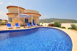 Holiday villa for rent near Jávea, in the area of Benitachell, Costa Blanca, for up to 6 people .Modern, newly built villa on one floor, situated on a level plot with nice views over the valley and the sea in the distance. The house has recently been refurnished and tastefully decorated. From the lounge/dining room, you have access directly onto the covered terrace which overlooks the swimmingpool. There is a spacious dogkennel on the plot, so if you would like to take your loyal four-legged friend, it can stay safely at the property as well!, Javea